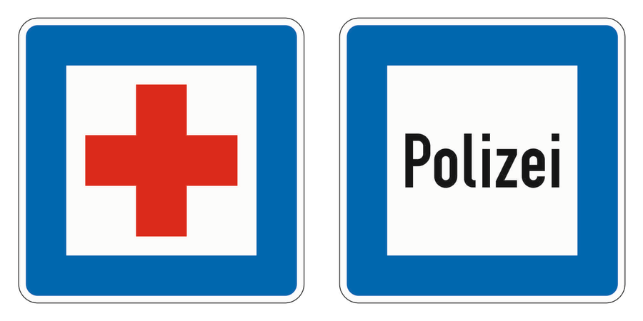 Links das offizielle Zeichen Erste Hilfe mit rotem Kreuz im weißen Feld, rechts das offizielle Zeichen Polizei mit der Aufschrift Polizei.