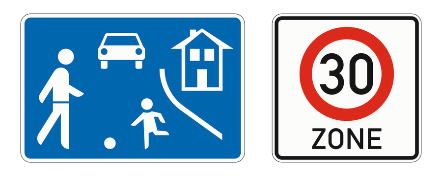 Links das blaue Schild Beginn eines verkehrsberuhigten Bereichs, rechts Beginn einer Tempo-30-Zone.